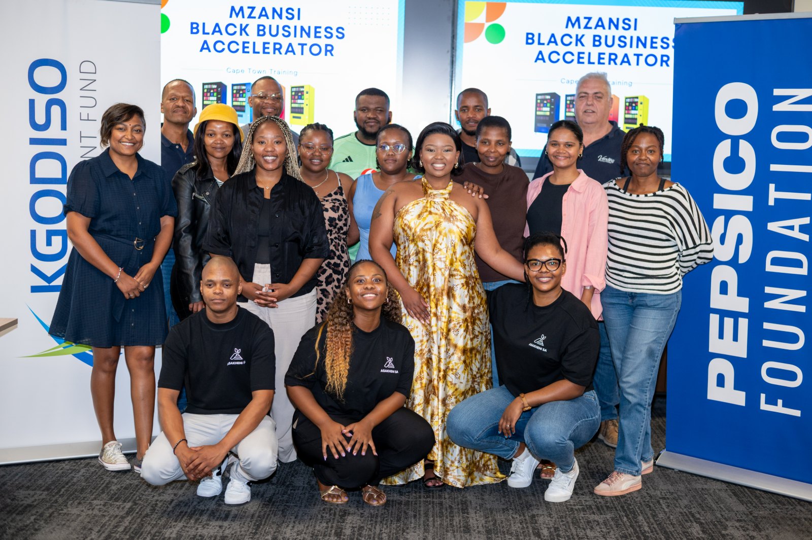 The Asakheni SA team and MBBA cohort together in Cape Town, framed by the Kgodiso Development Fund and PepsiCo Foundation banners